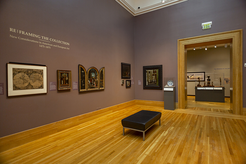 a photo of paintings on a wall of a museum