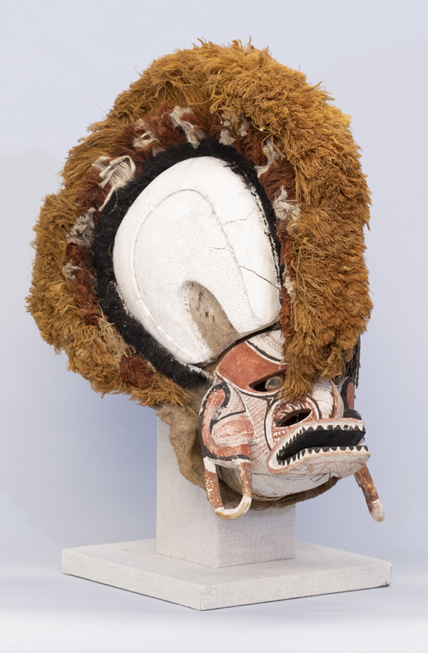 a full-head mask, made of wood and natural fibers in the 19th century