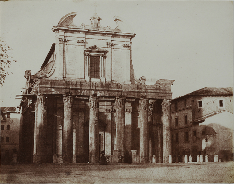 an old photograph of a  temple/building with columns