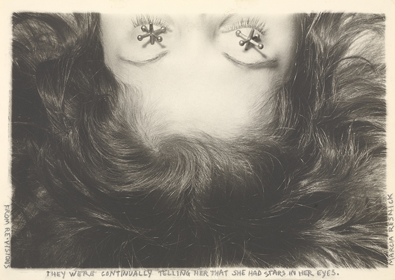 a black and white image of a close-up, up-side-down woman's face. Her eyes are closed and there are jacks on her eyelids.