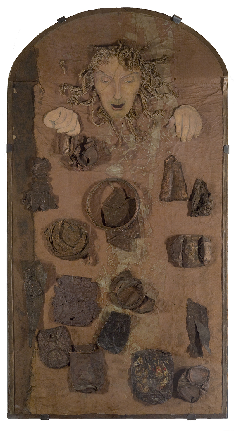  a mixed media piece  with a woman's head and various irregularly shaped objects