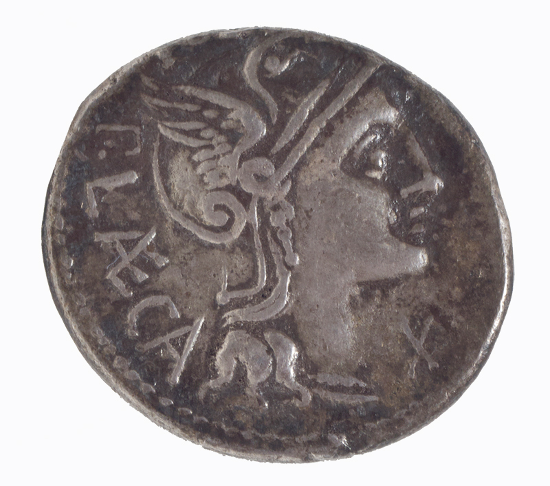 A silvery metal coin showing the profile of a person's head 