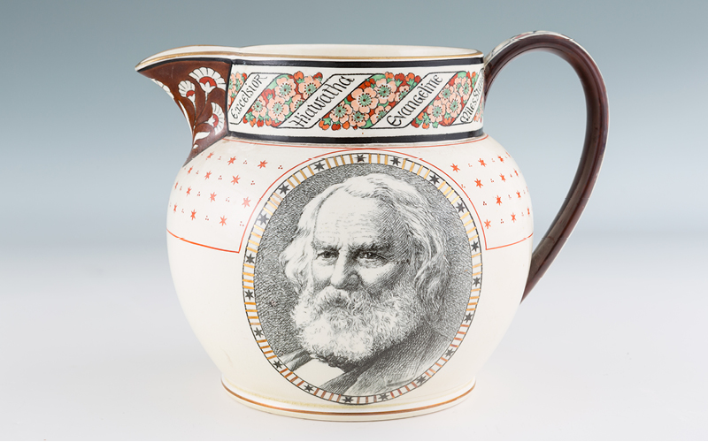 A jug featuring the likeness of Henry Wadsworth Longfellow as an older bearded man