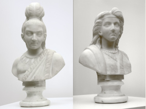 busts of man and woman in regalia—feather headdress, necklaces, and fur