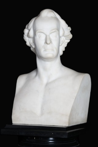 statue of man staring up to right