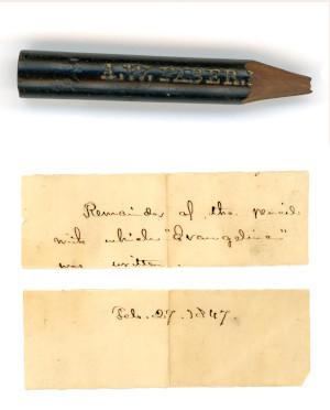 the remains of a well-used pencil with a scrap of paper with writing