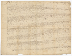 a yellowed page of parchment with fine cursive writing