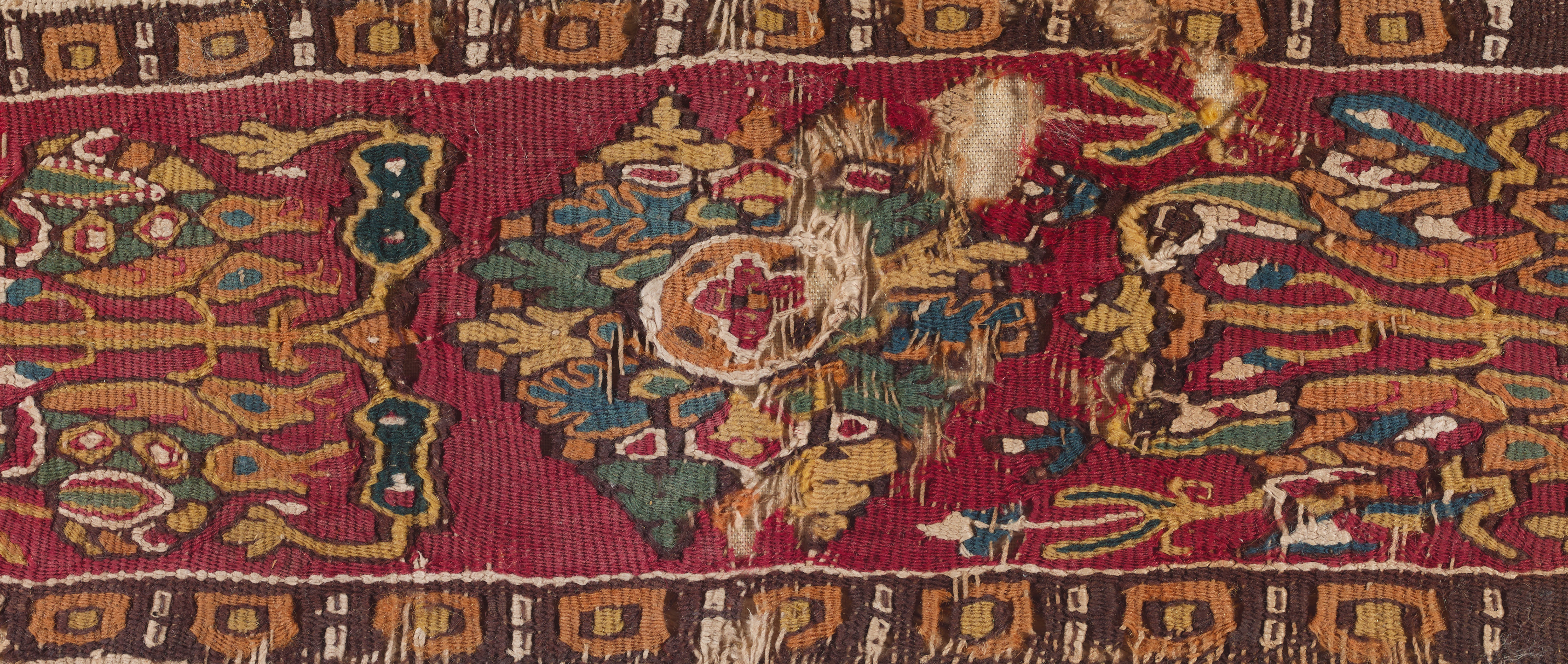 A detail of a colorful ancient textile