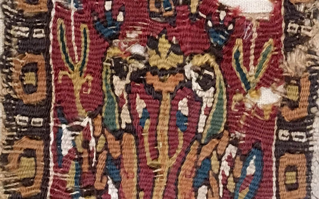 A detail of a colorful ancient textile