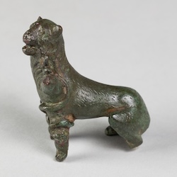 A small bronze sculpture of a dog