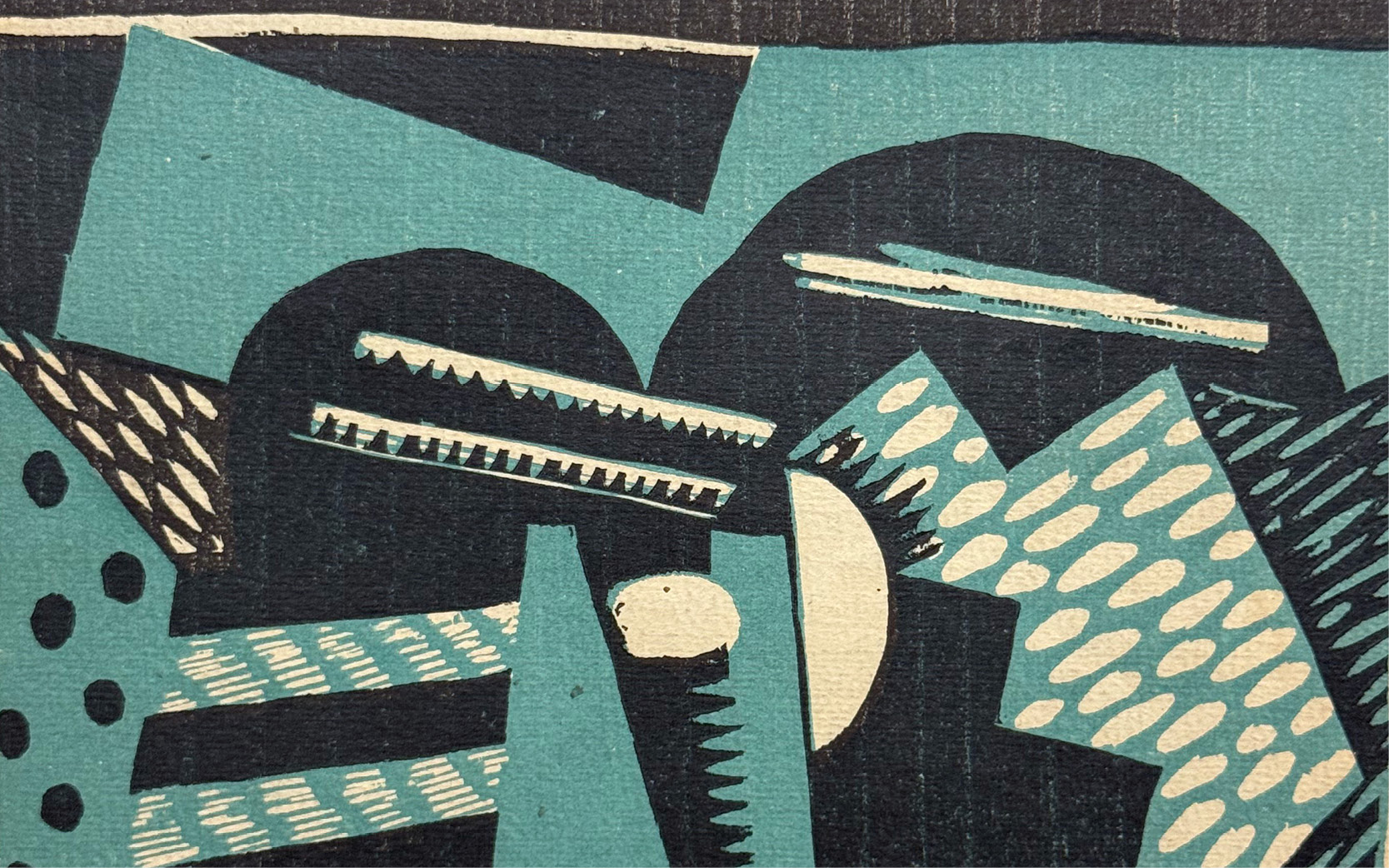 A detail of a magazine cover showing colorful abstract shapes in turquoise hues