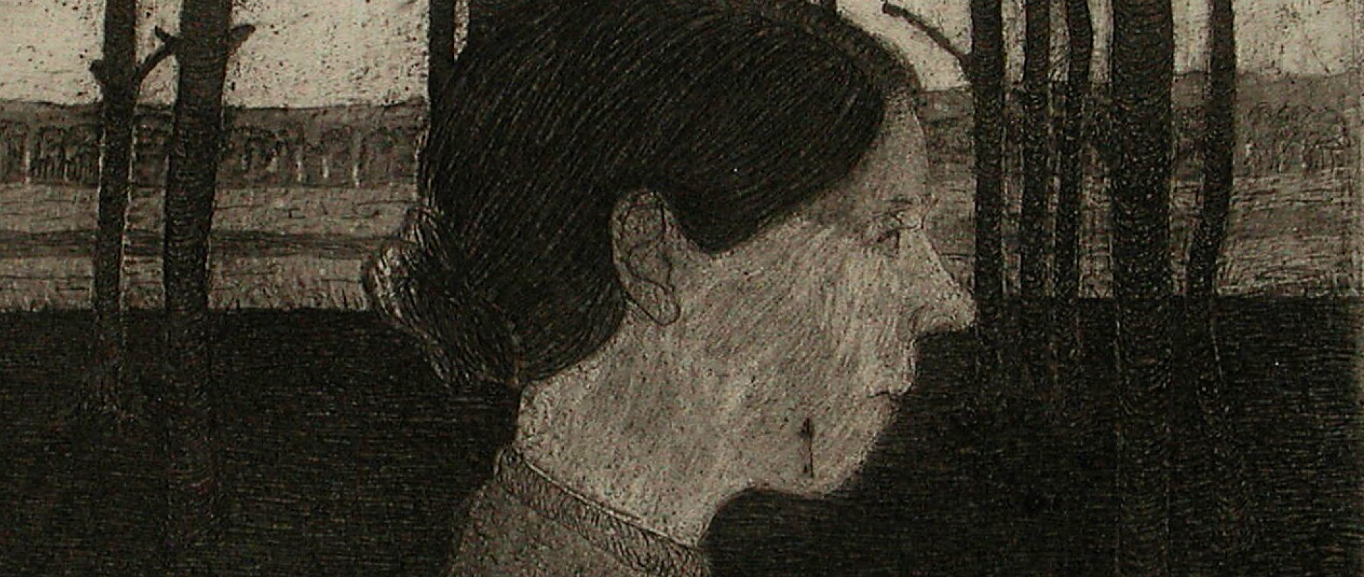 An etching of the profile of a woman