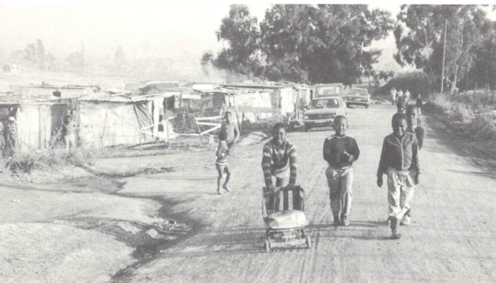 children walking down a dirt road