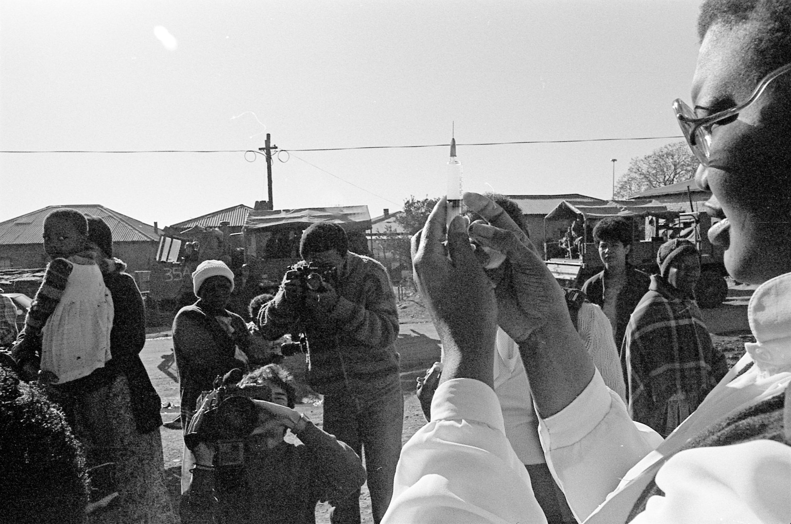 A person prepares a syringe.