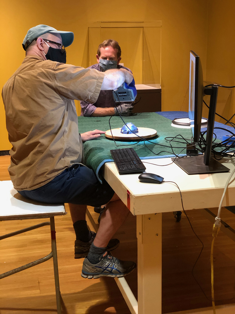 Two staff members using a 3d scanner at the Museum of Art