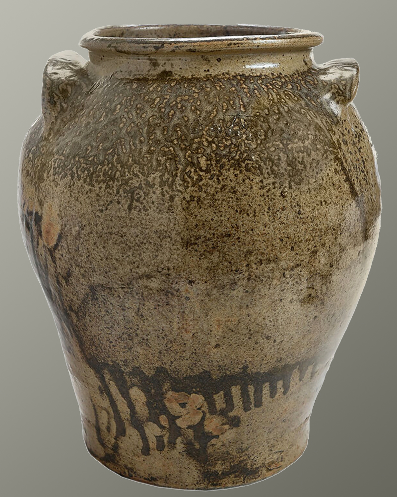 A jar with a brown glaze with small handles