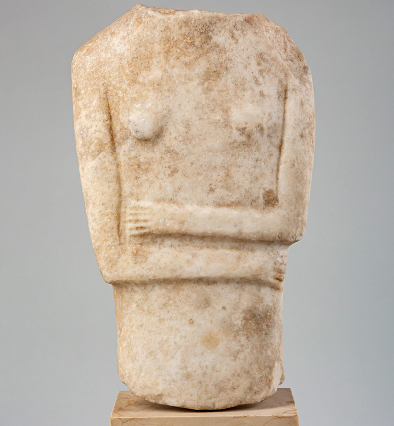 an ancient marble sculpture of a female torso