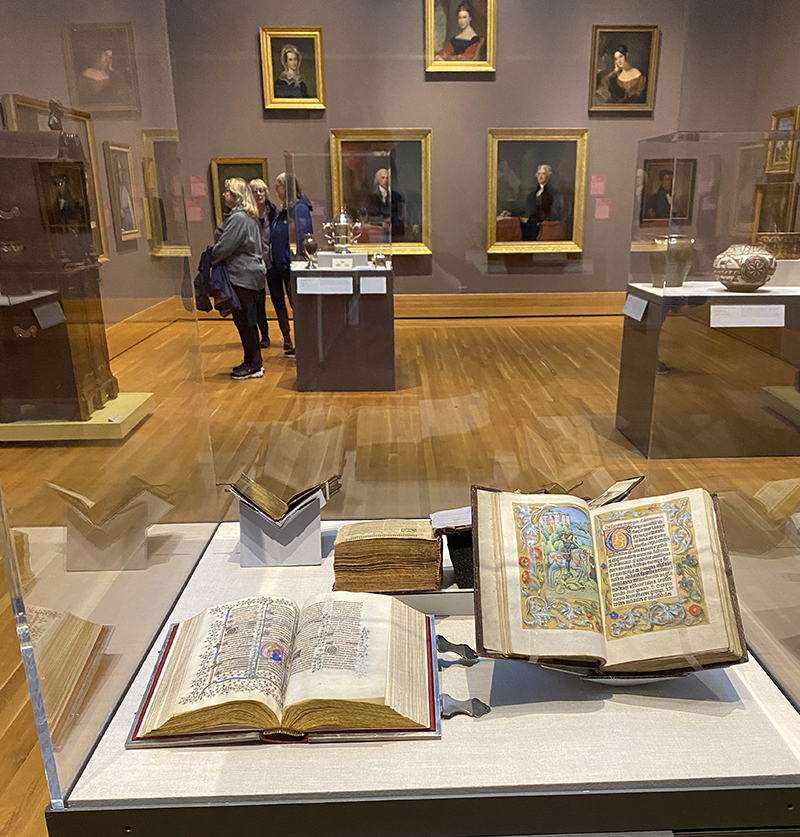 A view of illuminated manuscripts in a case in a museum gallery