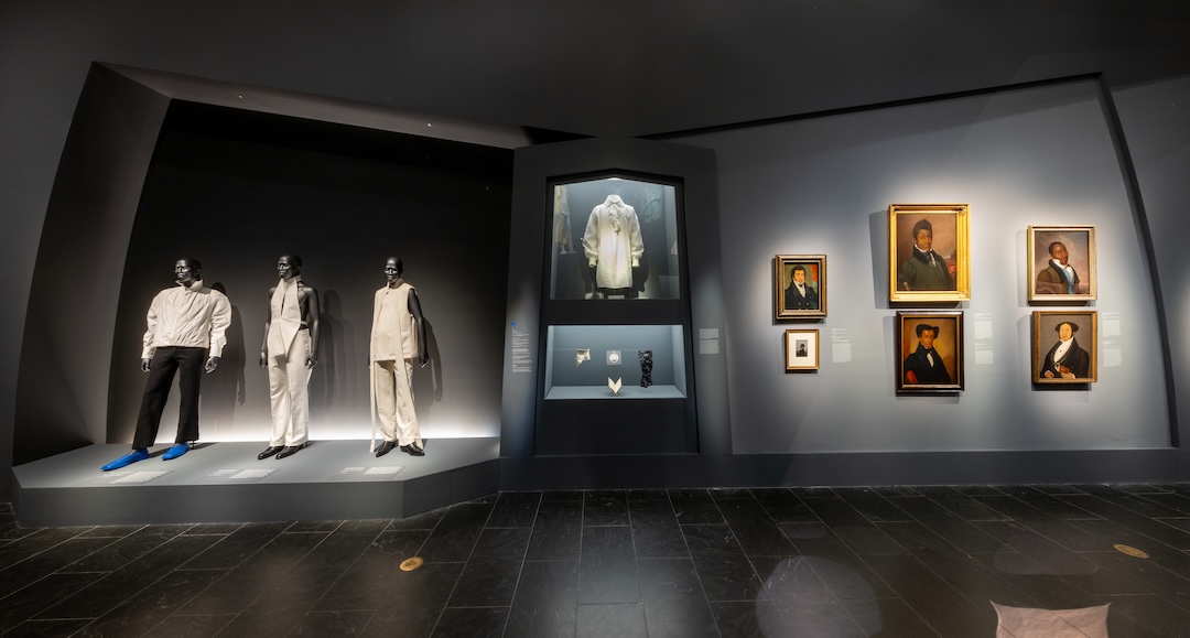 A fashion exhibition displays clothing and art