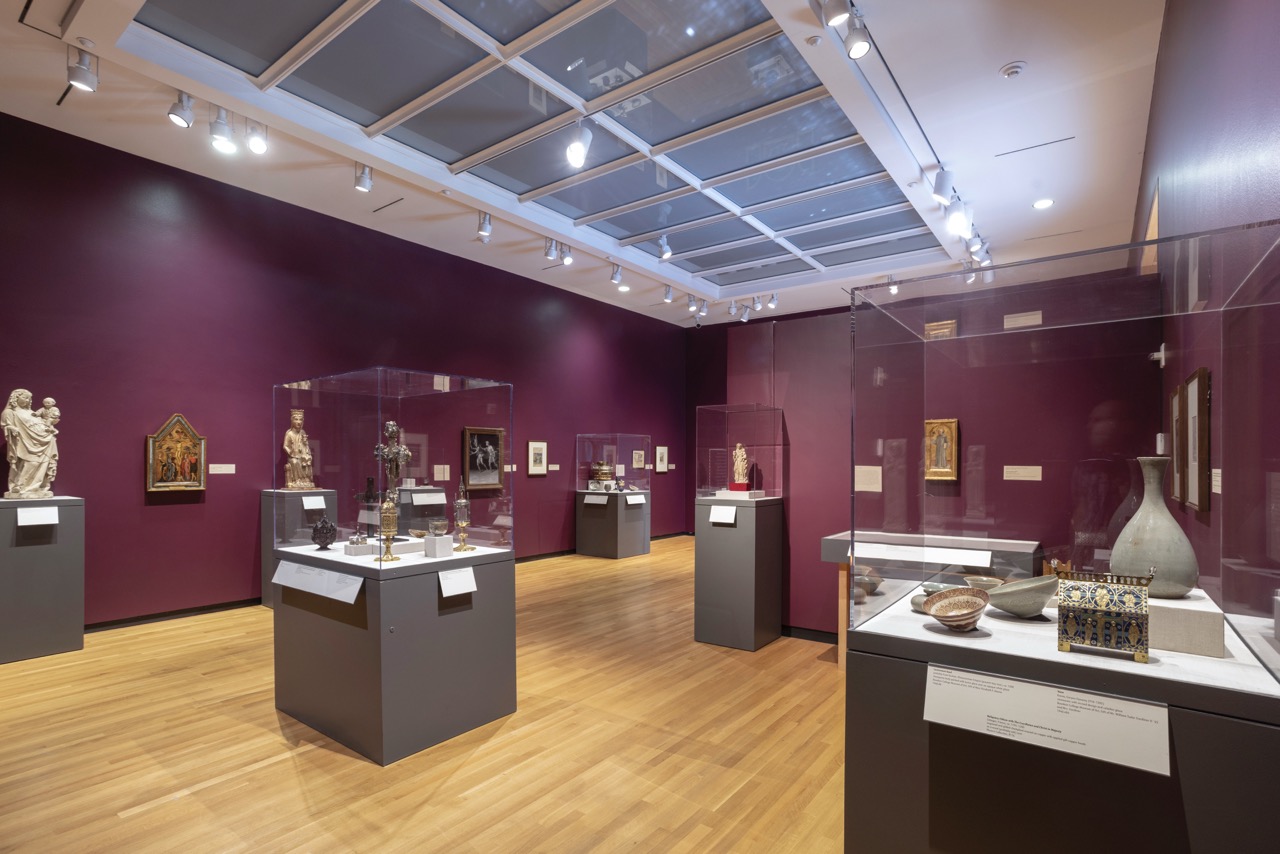 Medieval objects are displayed in an art museum gallery