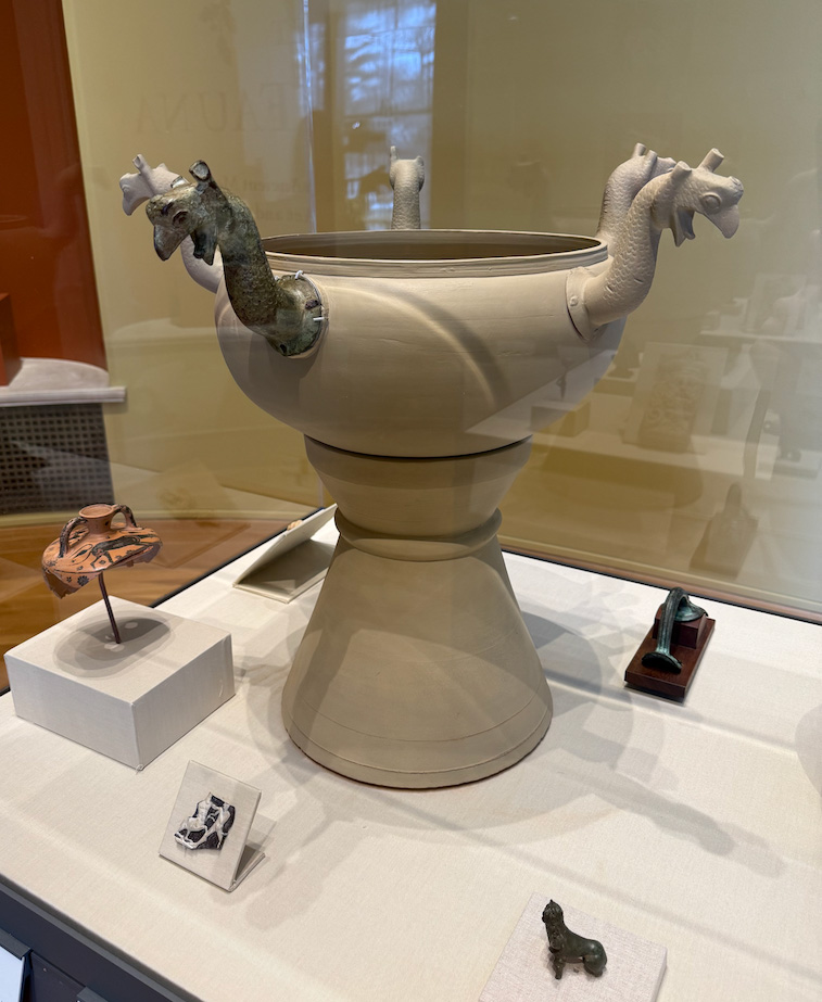Ancient artifacts inside a museum display case in a museum exhibition