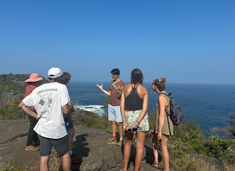 A student leads a tour on an island in Maine
