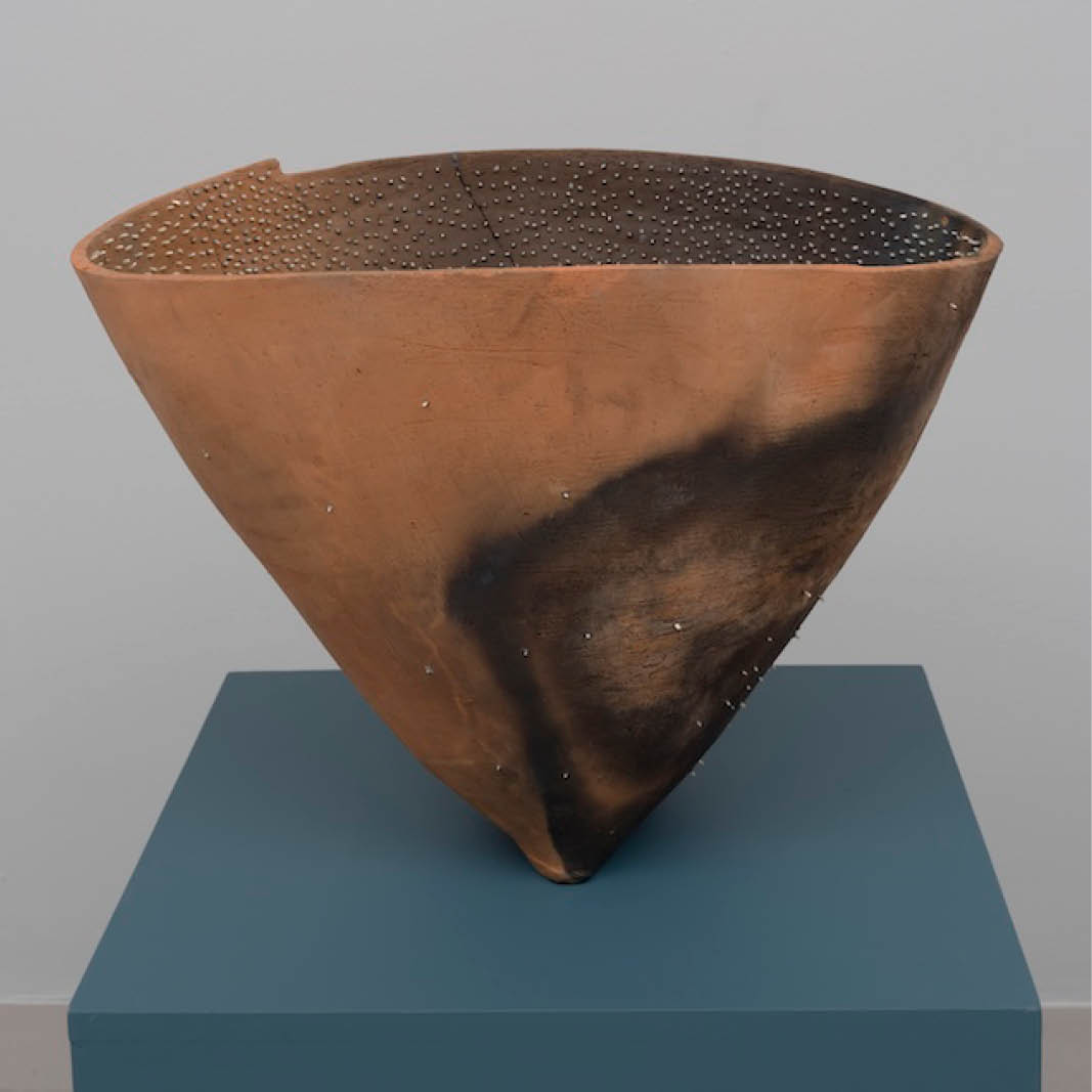 A cone shaped vessel on a pedestal