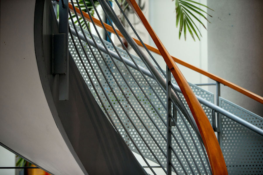 Spiral staircase leading up from the atrium in Druckenmiller Hall