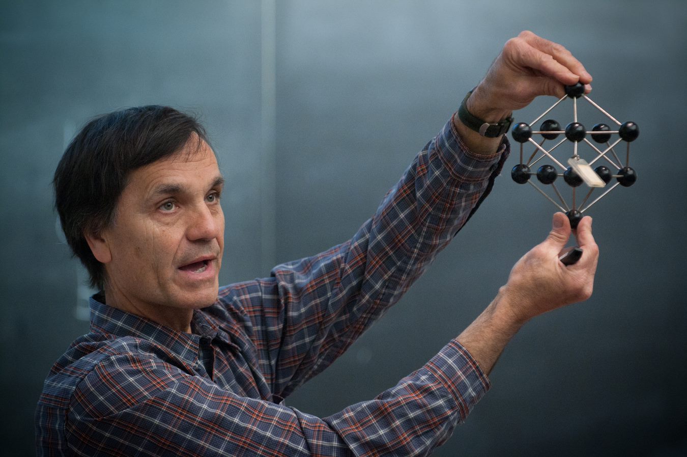 Professor Jeff Nagle holding a chemical structure