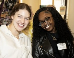 Ange poses for the camera with a coworker.