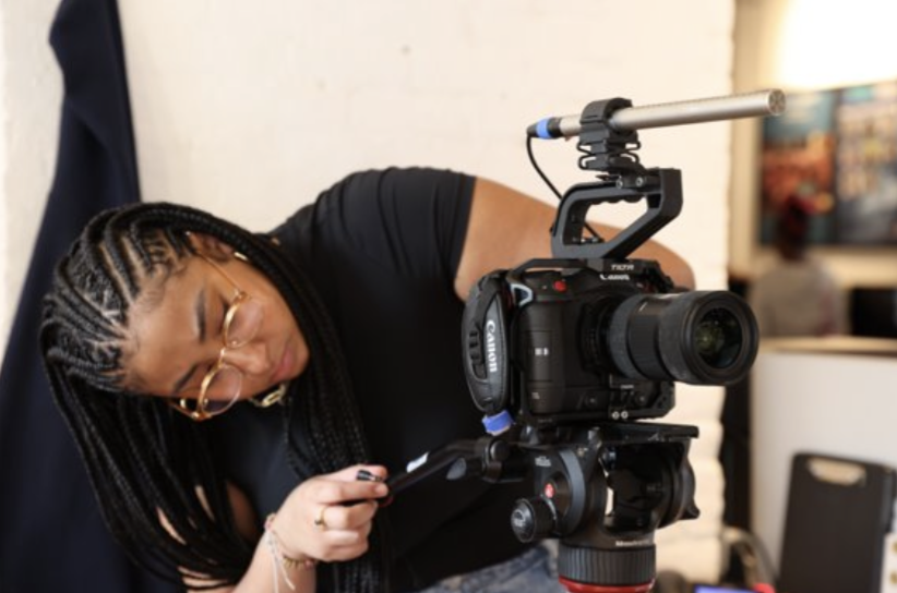 Anisa operates a camera.