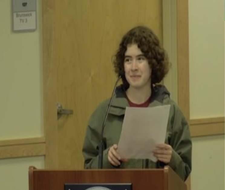 Charlotte delivers a speech on behalf of their department. 