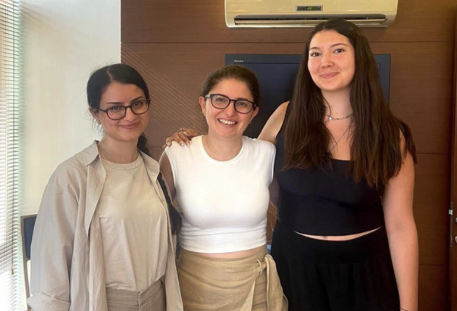 Dila poses with their team at Baysal Law Firm.