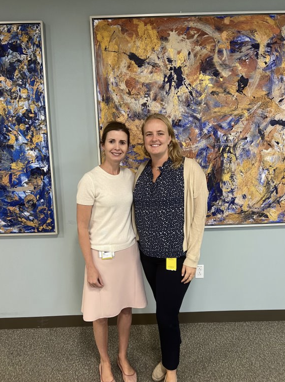 Emily poses with a coworker.