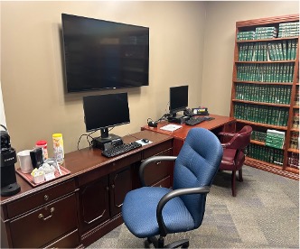 Image of an office space with a desk and chair