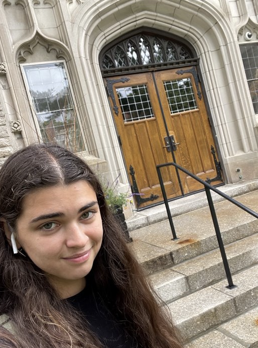Isabel poses in front of philosophy department at Tufts.