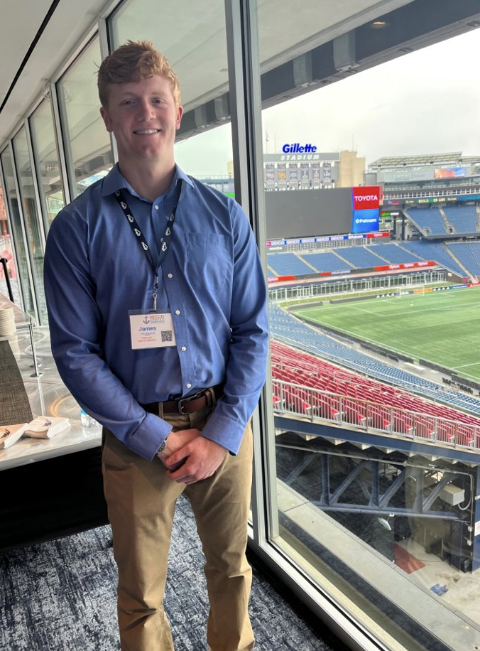 Jed poses at the NECCF conference at Gilette stadium.