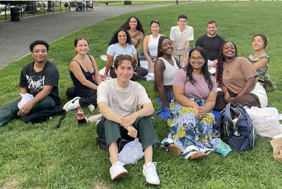 Jordyn with coworkers posing for picture at the park.