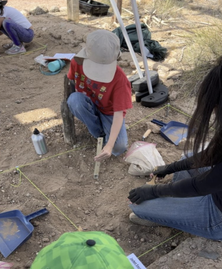 A photo of children working on their excavation skills, a program from the El Paso Museum of Archaeology.​