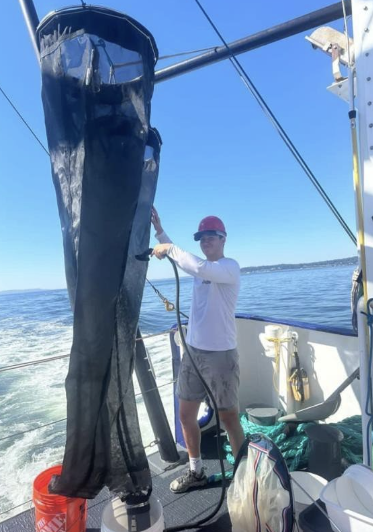Max on a boat, collecting data for the University of Washington Applied Physics Laboratory.