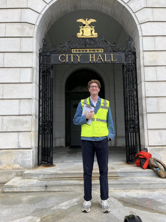Michael stands in front of Portland's City Hall.