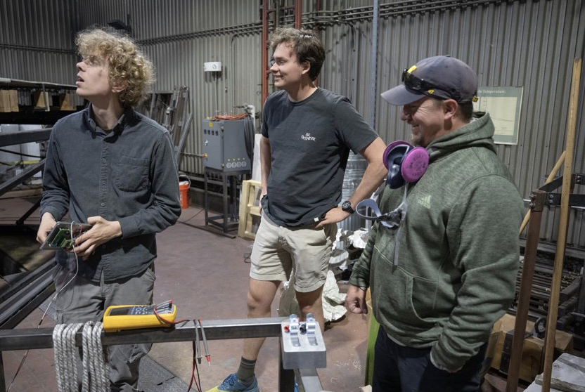 Ross and their coworkers work on a simulation relating to their wildland fire research.