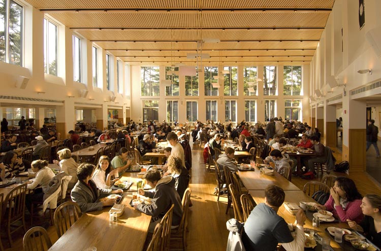 Thorne Hall: large room with high ceiling, rows of tables and the sun coming in floor to ceiling windows