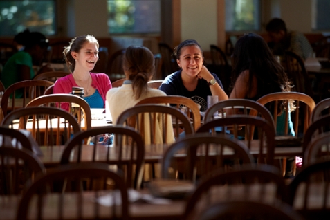 students laughing together in the dining hall