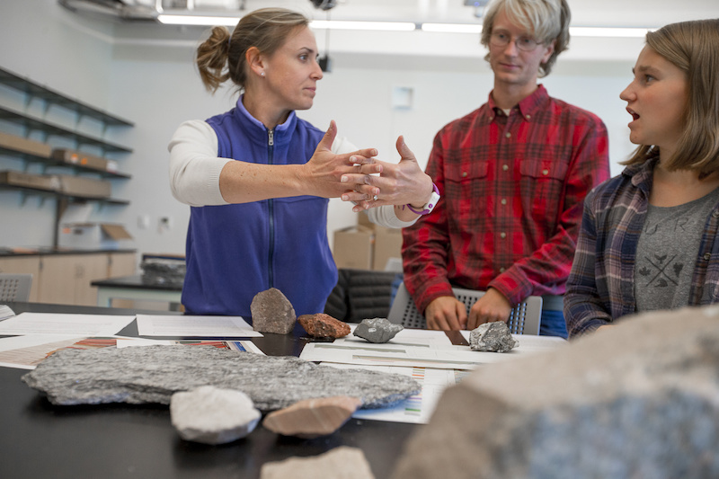 Emily Peterman with two students