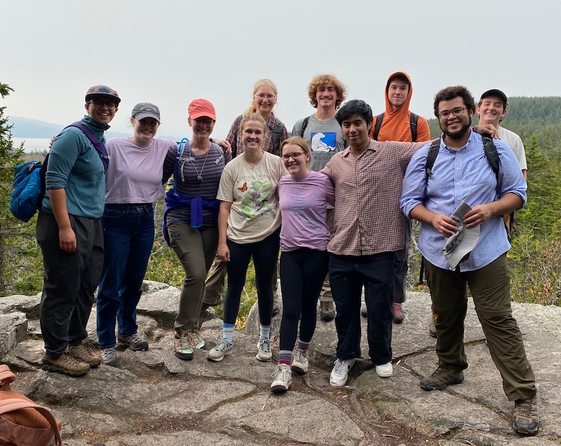 Students and faculty stop for a picture during their hike on the Schoodic Head Trail