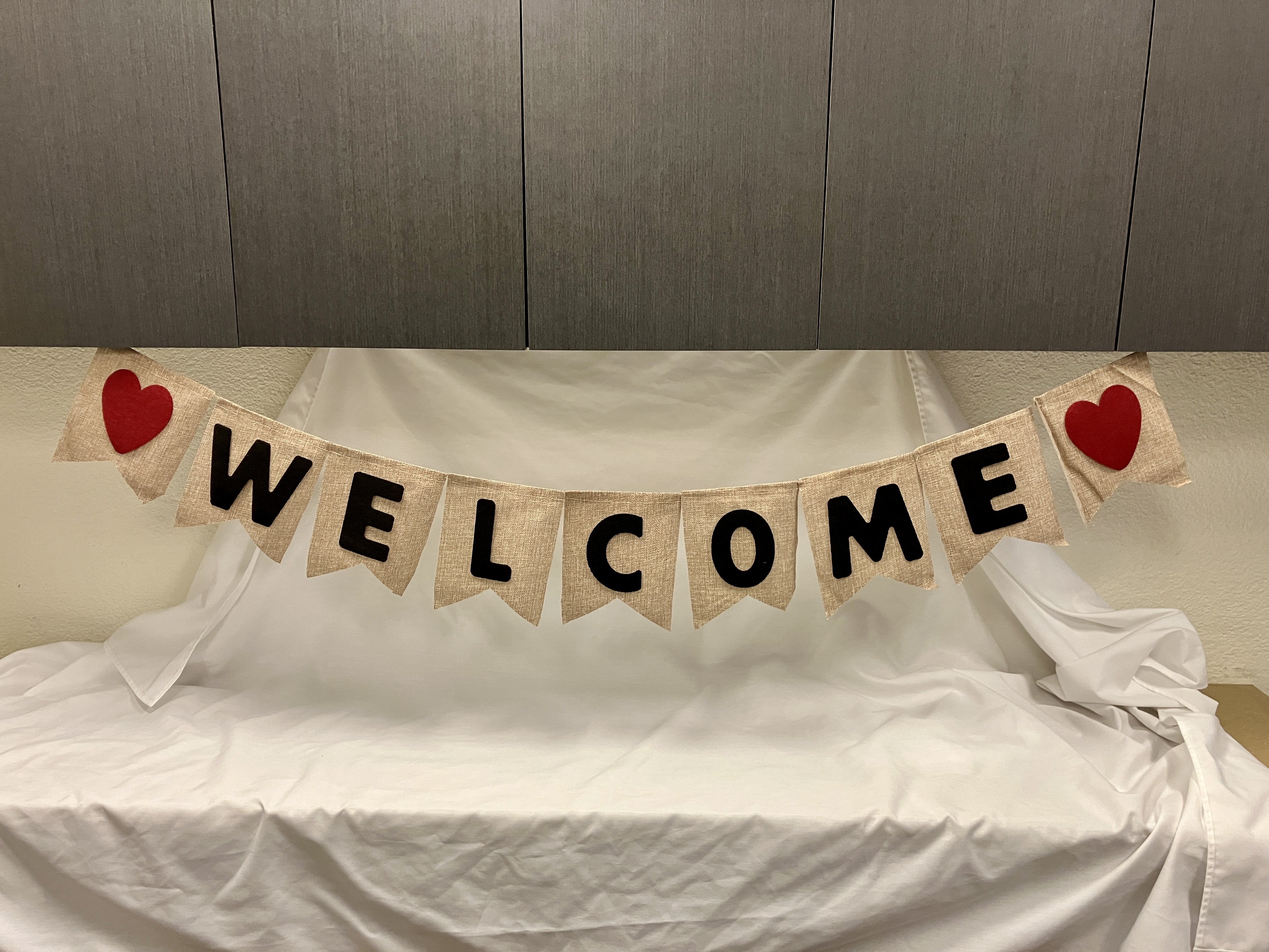 Cloth banner with text that says, "Welcome"