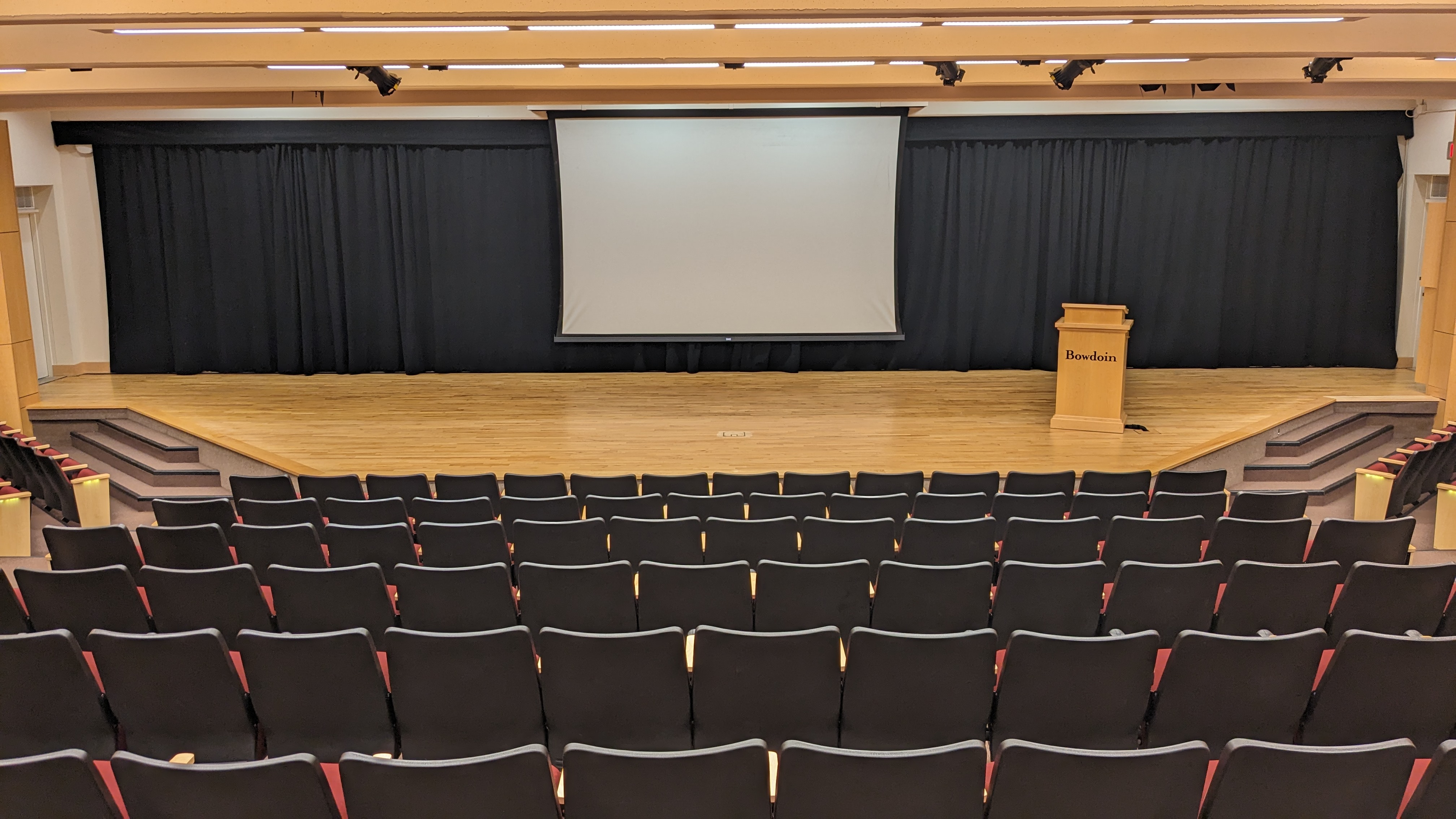 Light wooden stage and theater style seating