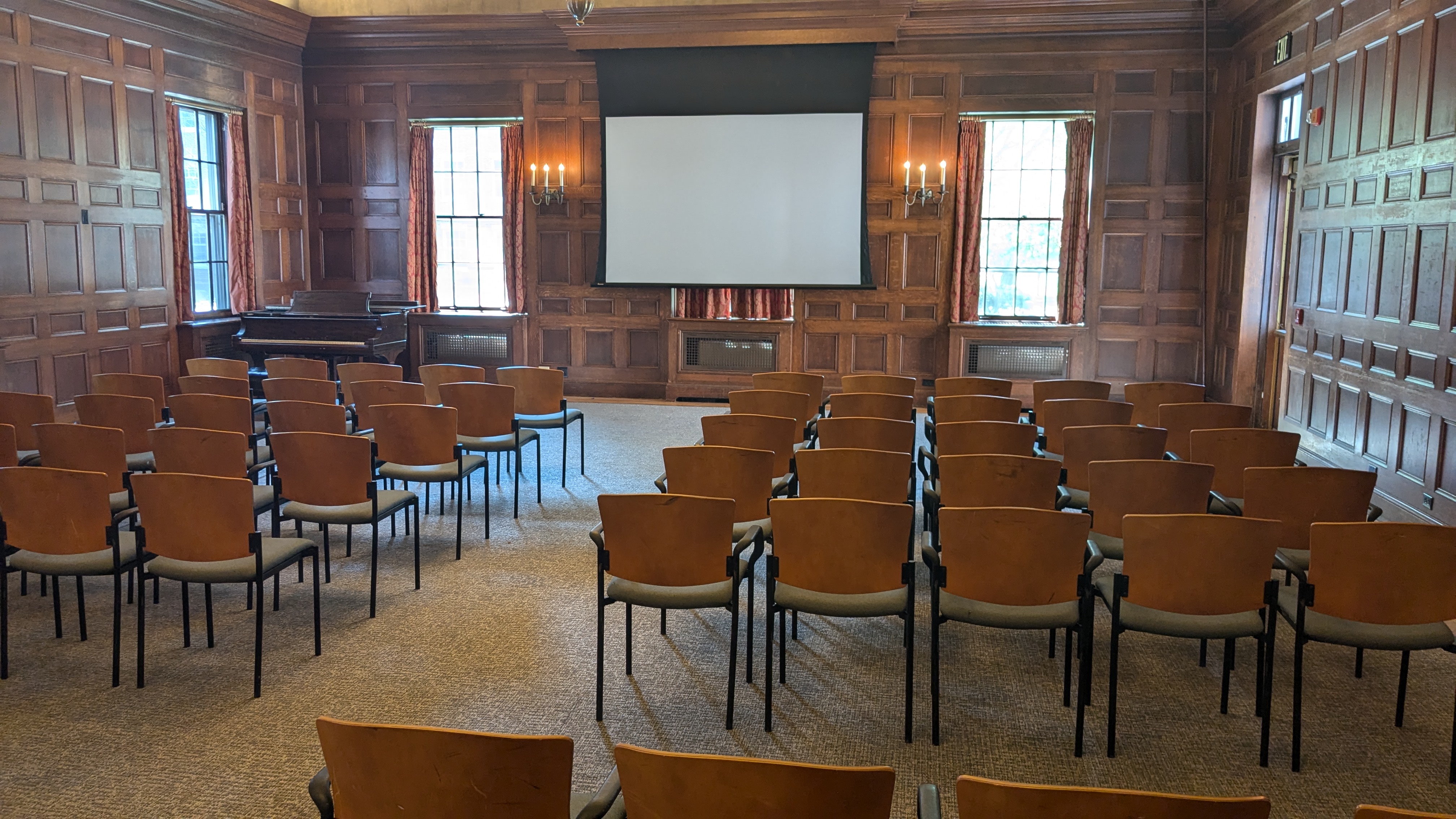 Chairs facing projector near windows in Main lounge