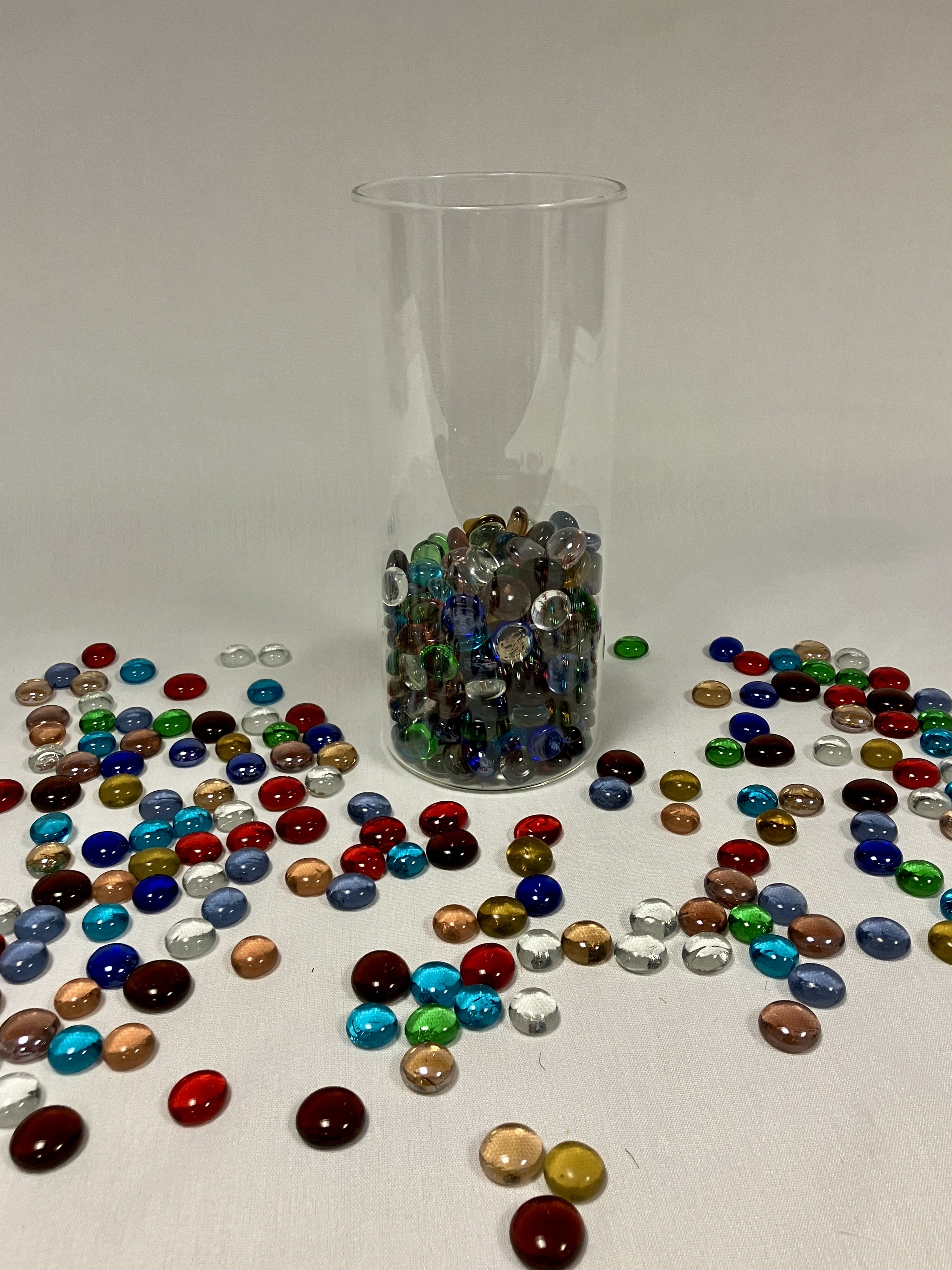 image of vase partially filled with colorful marbles